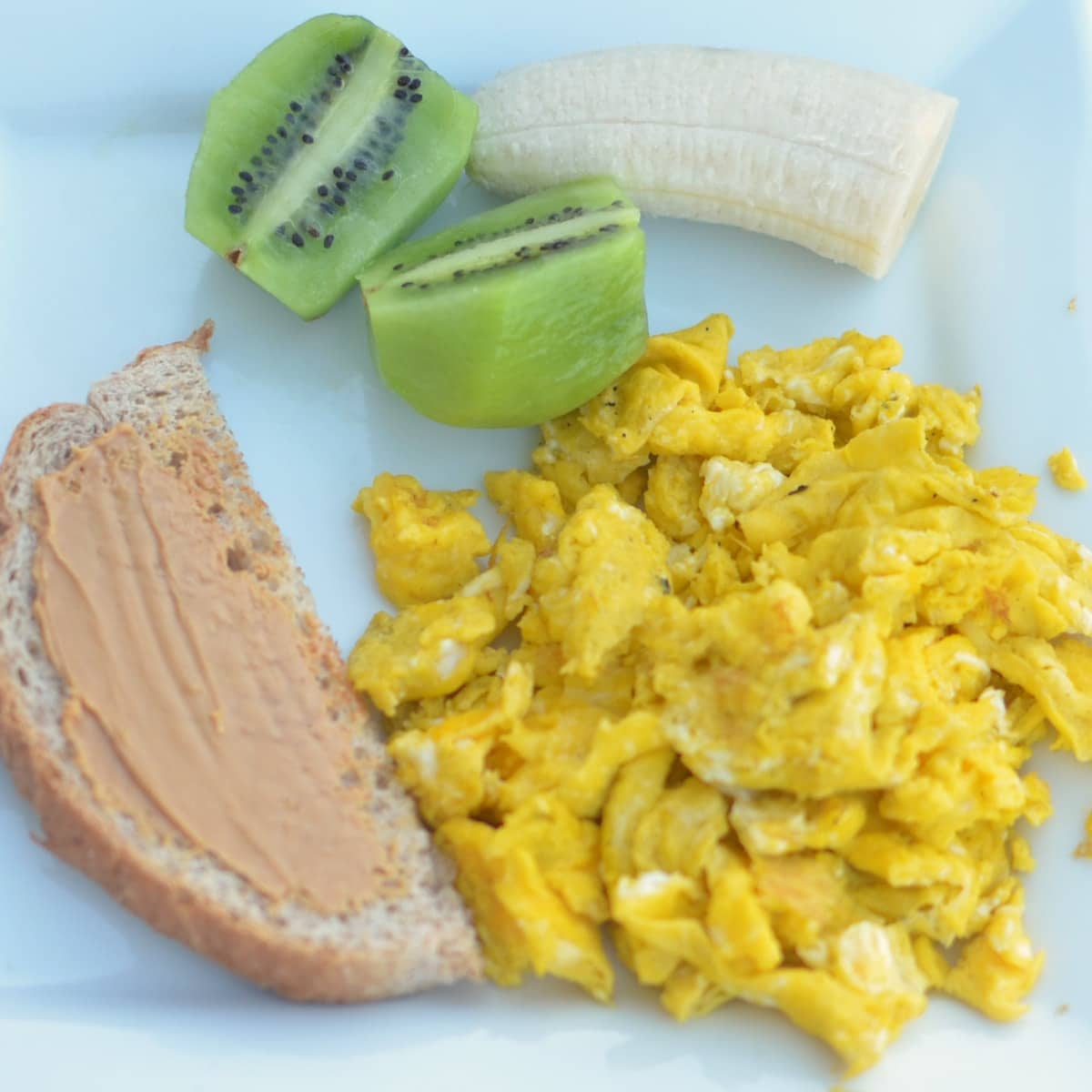 Scrambled Eggs with Peanut Butter Toast and Kiwi Super Healthy Kids